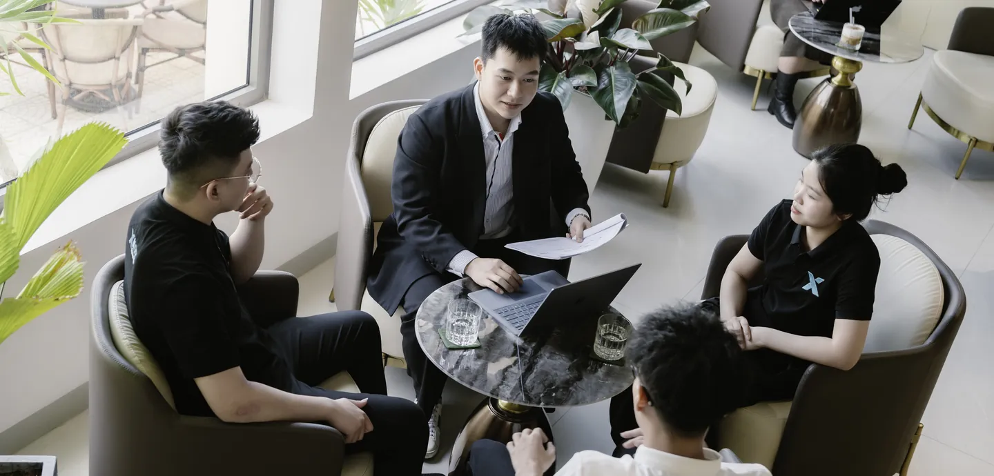 The XNOR Group team, who build Keyvaci, meeting around a table